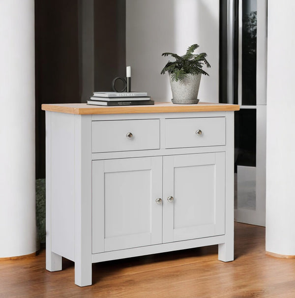 Vista lateral decorada del mini buffet Boreal en tono blanco mate