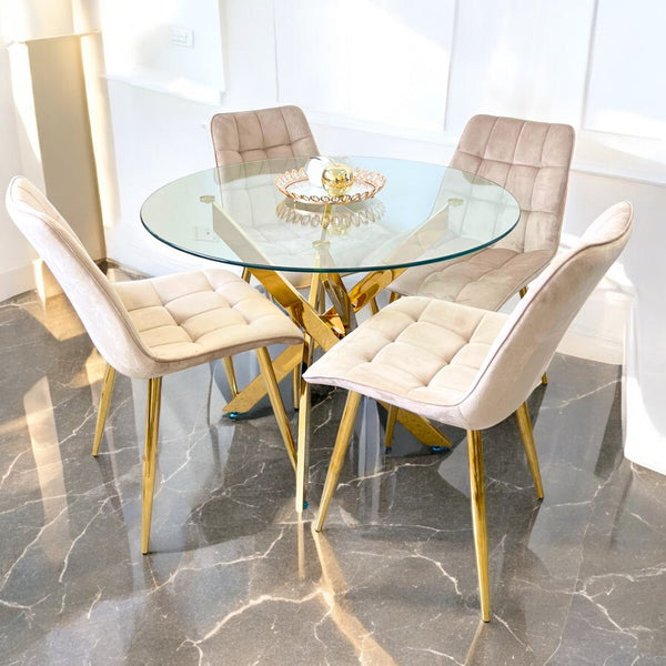 Detalle de mesa redonda de vidrio templado con estructura dorada elegante
