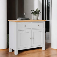 Vista lateral decorada del mini buffet Boreal en tono blanco mate
